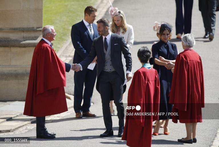 David Beckham dan Victoria Beckham tiba pada upacara pernikahan Pangeran Harry Inggris, Duke of Sussex dan aktris AS Meghan Markle di Kapel St George, Kastil Windsor, di Windsor, pada 19 Mei 2018.